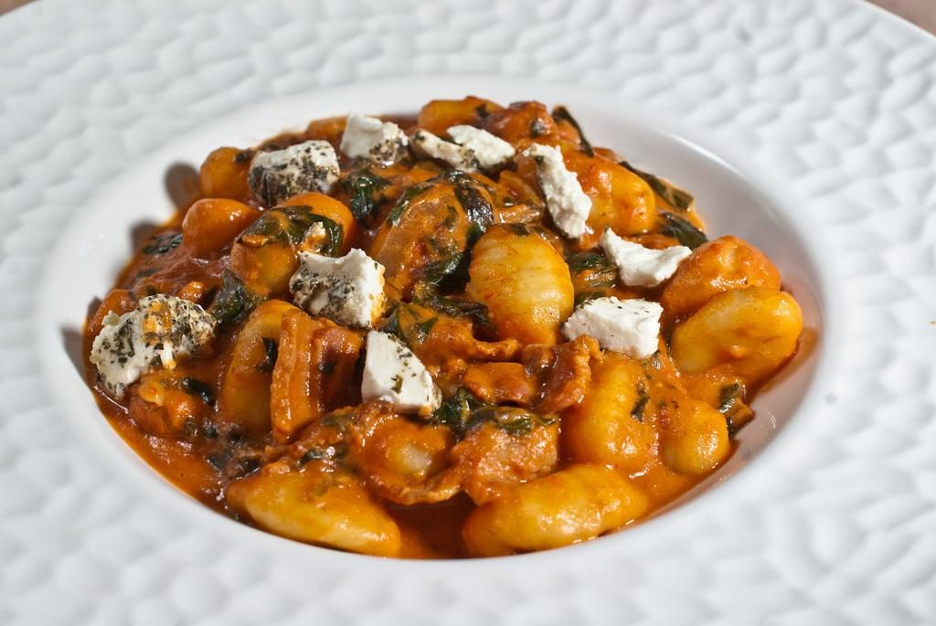 Gnocchi with Bacon, Spinach, Vidalia Onion and Herbed Goat Cheese in Rosé Sauce