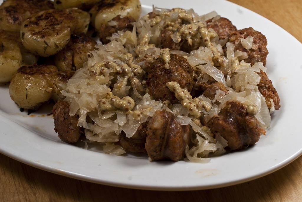 Sausage and Sauerkraut with Garlicky Herb Smashed Potatoes