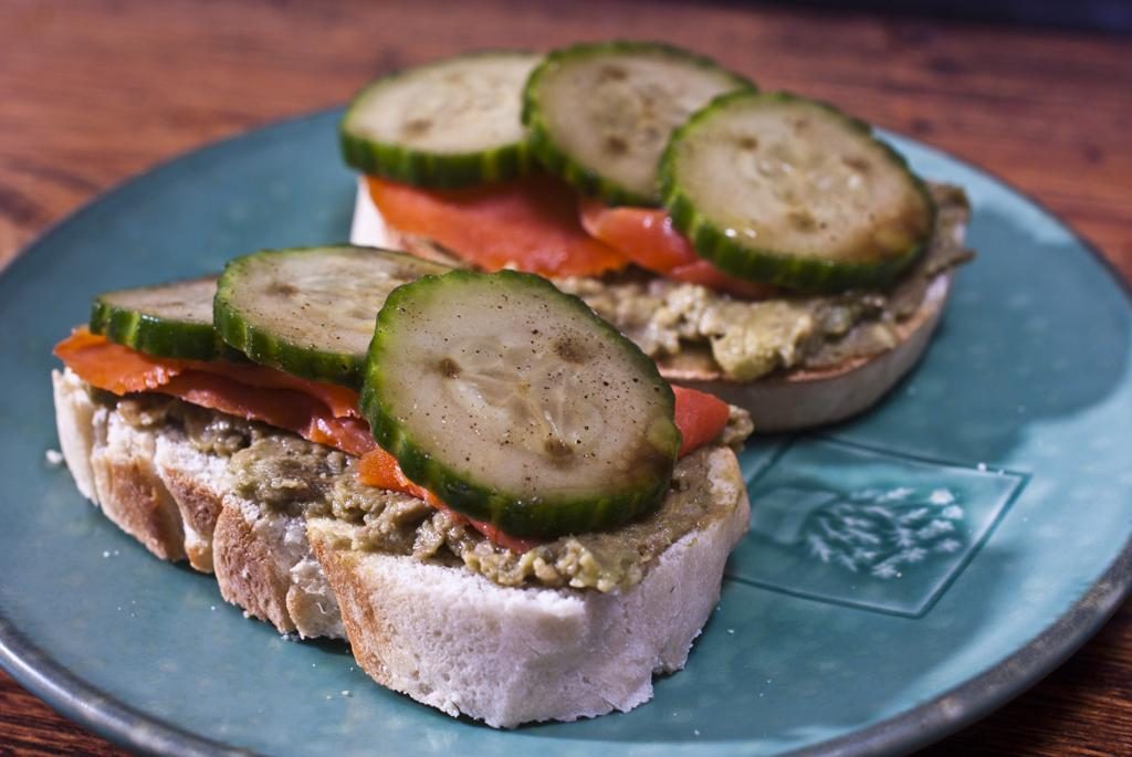 Guacamole, smoked salmon, and cucumbers tossed in balsamic vinaigrette on home made bread