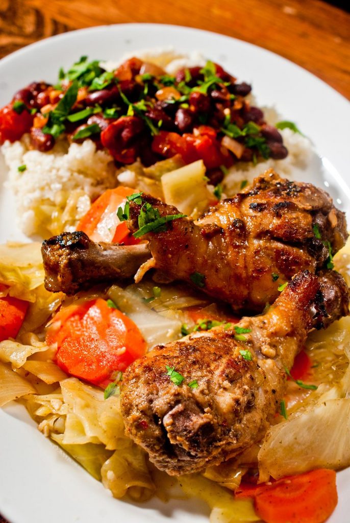 Jerk Chicken, Cuban beans on riced cauliflower, steamed cabbage and carrots