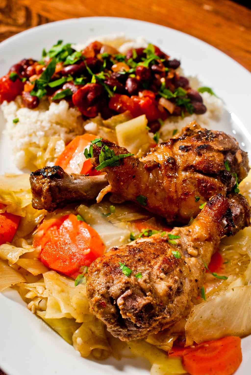 Jerk Chicken, Cuban beans on riced cauliflower, steamed cabbage and carrots