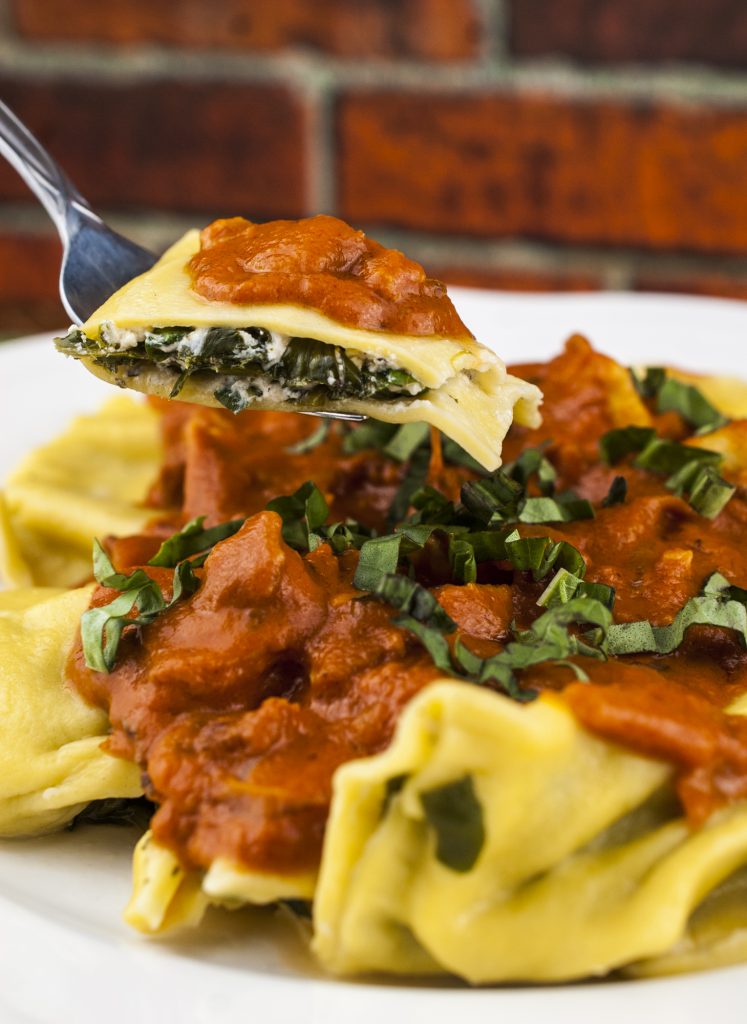 Spinach and Goat Cheese Ravioli in Rosé Sauce with Bacon and Vidalia Onion