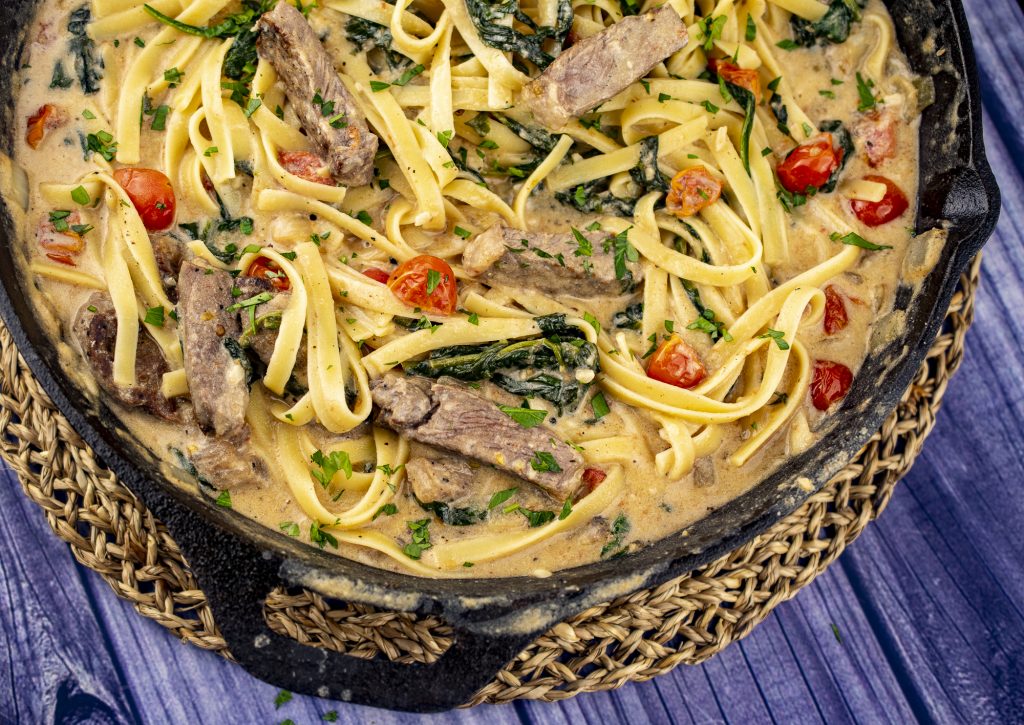 One Pot Fettuccine Alfredo with Spinach, Steak, and Cherry Tomatoes